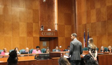City Controller Chris Hollins (left) warns council about the city's deficit spending during an Oct. 8 city council meeting. (Sarah Brager/Community Impact)