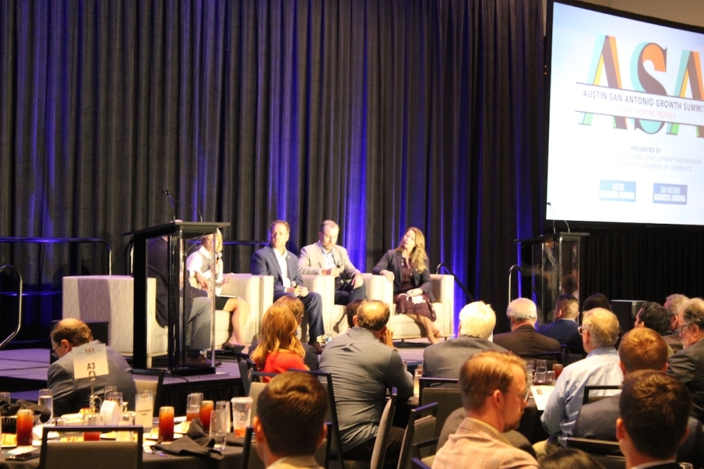 Economic development officials from across the I-35 corridor participated in a discussion panel about the region during the Oct. 8 summit. (Andrew Creelman/Community Impact)