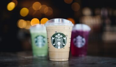Three drinks from Starbucks are seen on a wooden table as a promotional photo from the company.