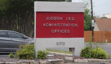 A sign for the Judson Independent School District administrative offices are seen on a cloudy day in Live Oak, Texas.