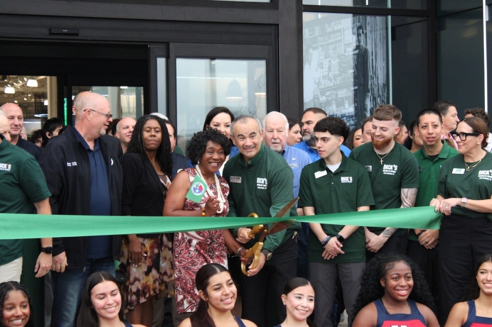 The store's Executive Director, Mario Trevino, and Live Oak Mayor Mary Dennis celebrated the store's grand opening Oct. 24. (Andrew Creelman/Community Impact)