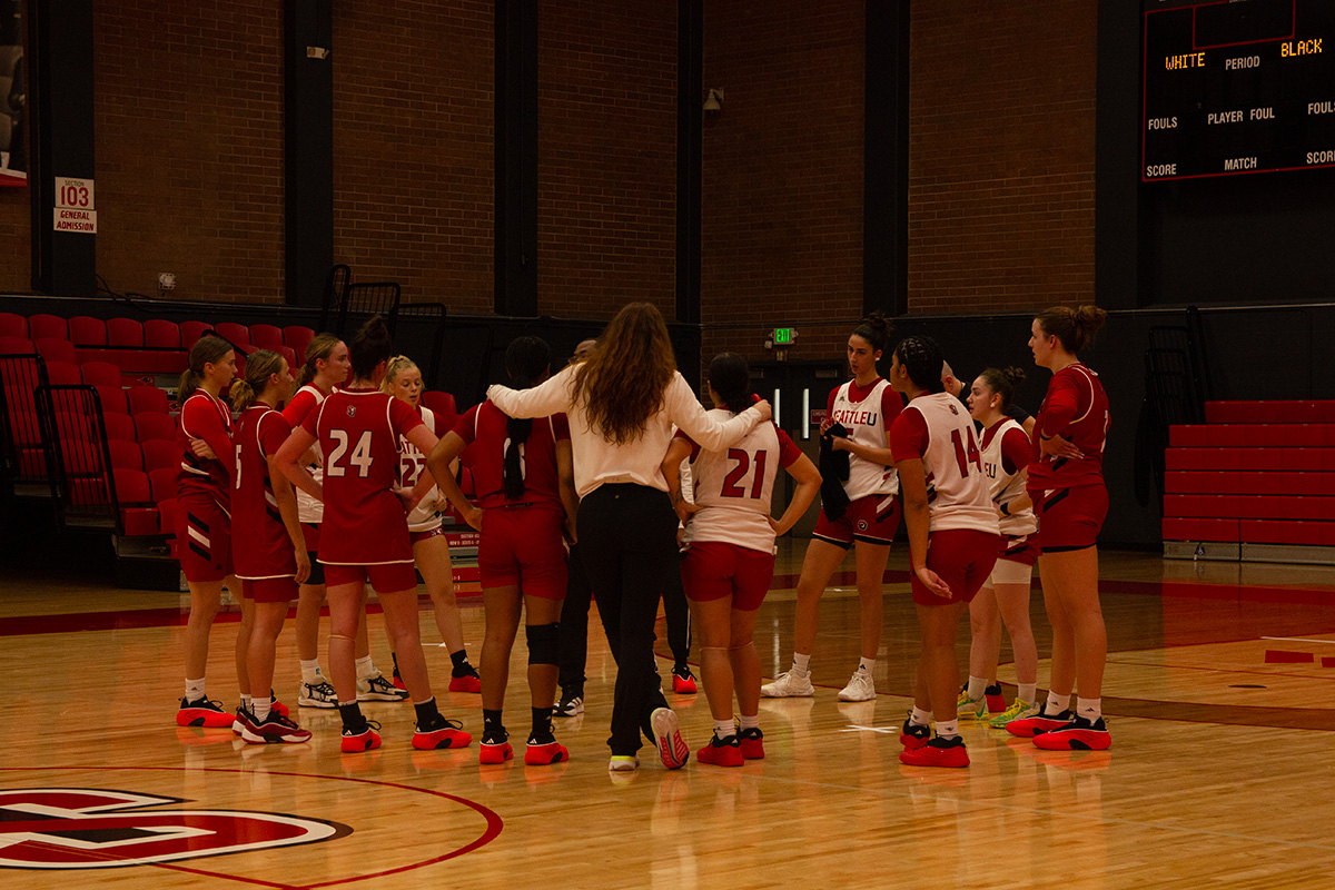 Redhawks in a team huddle during practice.