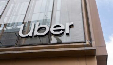 Uber sign on its headquarters building in San Francisco, California, USA - June 6, 2023. Uber Technologies is a transportation conglomerate.