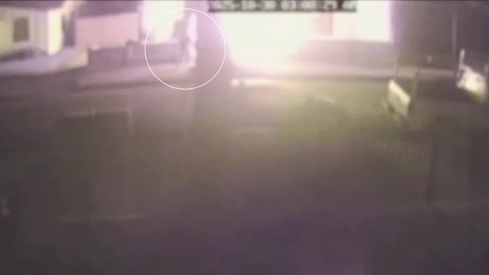 Surveillance cameras from a neighbor captured grainy footage of the two arsonists running away after setting a home in the West Adams neighborhood of South Los Angeles on fire in the middle of the night on Oct. 30, 2025. 