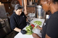 Kimberly High (right), owner of Joppy Momma’s Farm, delivers vegetables to Michelle...