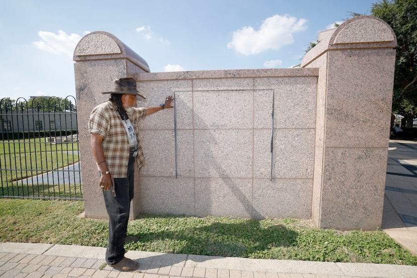 Clarence Glover, former SMU professor of African American studies, shows the wall where a...