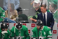Dallas Stars head coach Glen Gulutzan looks on during the third period of an NHL hockey game...
