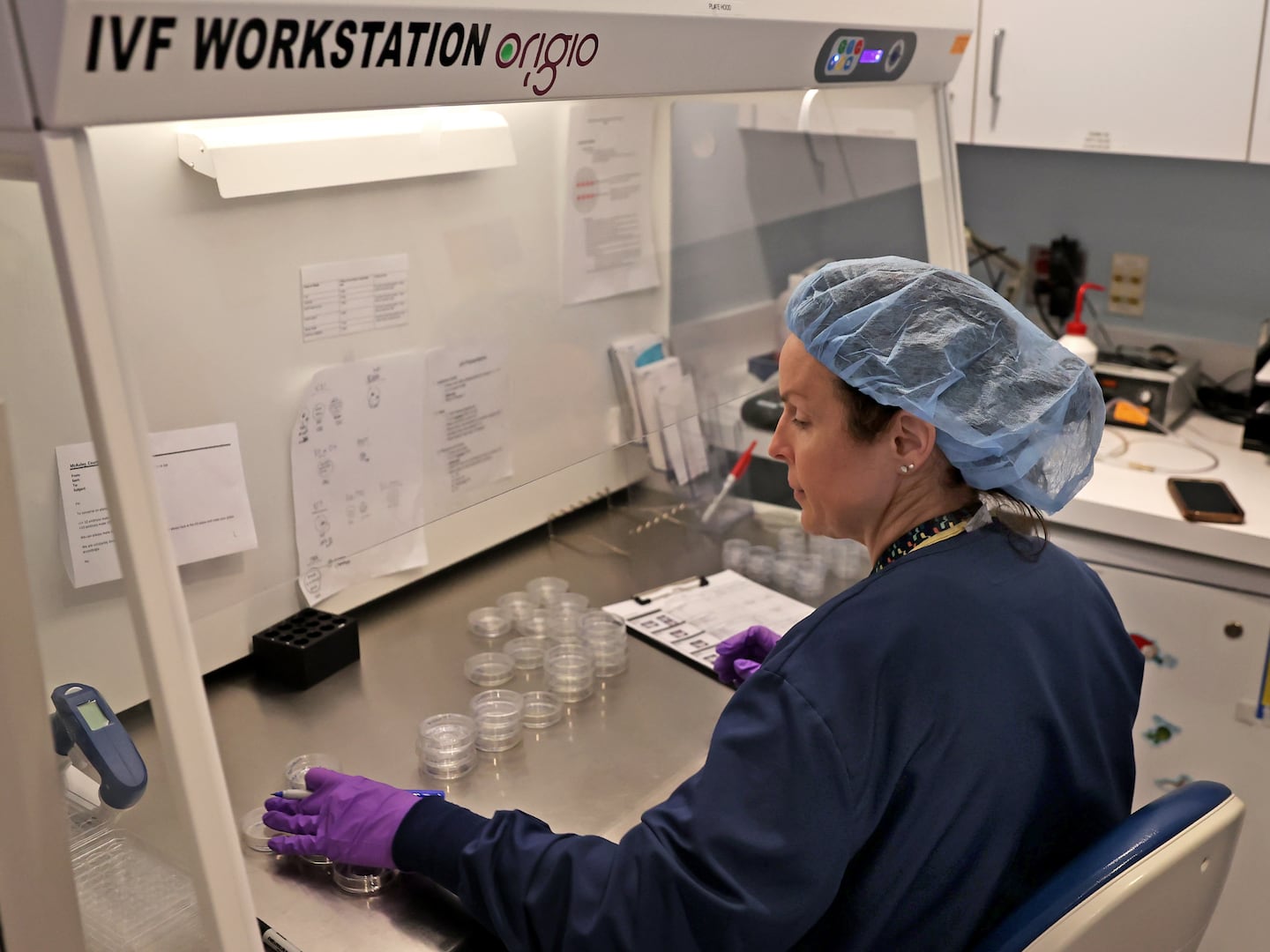 A embryologist worked at her work station in the IVF lab at the Brigham & Women's Hospital in Boston in 2024.