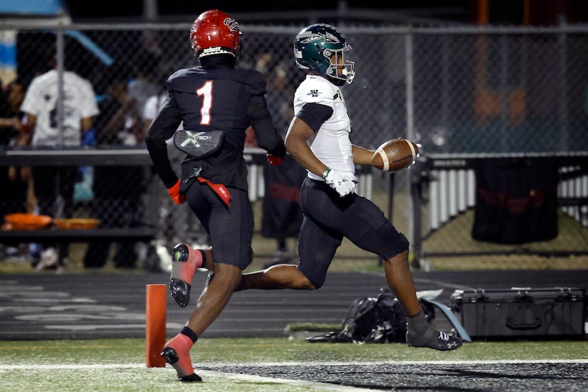 Waxahachie wide receiver Kohen Brown (8) cruises into the end zone as Cedar Hill defensive...