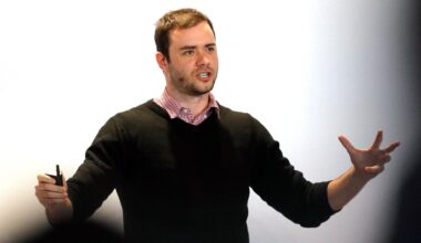 OpenAI CEO founding member Andrej Karpathy speaks to an audience with his arms open