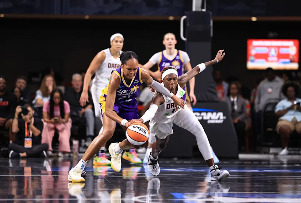 <p>Rhyne Howard swipes the ball from Azurá Stevens. </p><br>