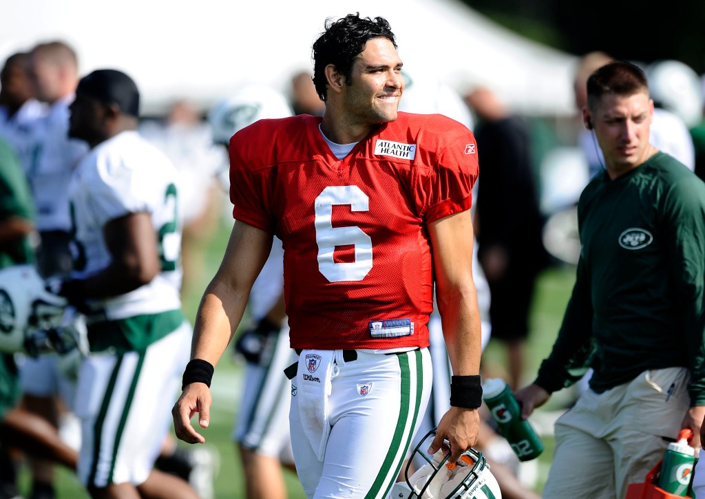 Mark Sanchez wearing a red New York Jets practice jersey with number 6.