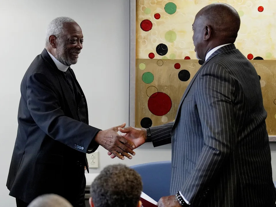 Reverend Edwin C. Sanders, Senior servant and founder of Metropolitan Interdenominational Church shakes hands with Meharry Medical College CEO and President Dr. James Hildreth at the Meharry Medical College's Center for Excellence in Clinical and Translational Research Monday, Oct. 6, 2025 in Nashville, Tenn. Meharry is launching a study to increase the global genomic database to include more people of African ancestry because they now only comprise 2% or less of the data. Expanding the database will help predict disease risks and guide prevention and treatment.