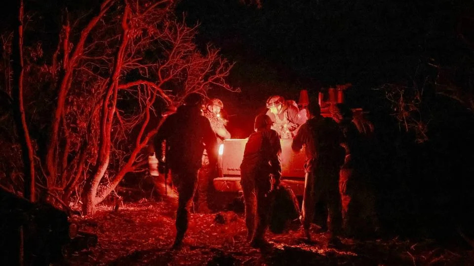 Artillerymen of the 152nd Separate Jaeger Brigade get into a car after a combat mission near the frontline town of Pokrovsk in Donetsk region, Ukraine, on October 15, 2025. - Anatolii Stepanov/Reuters