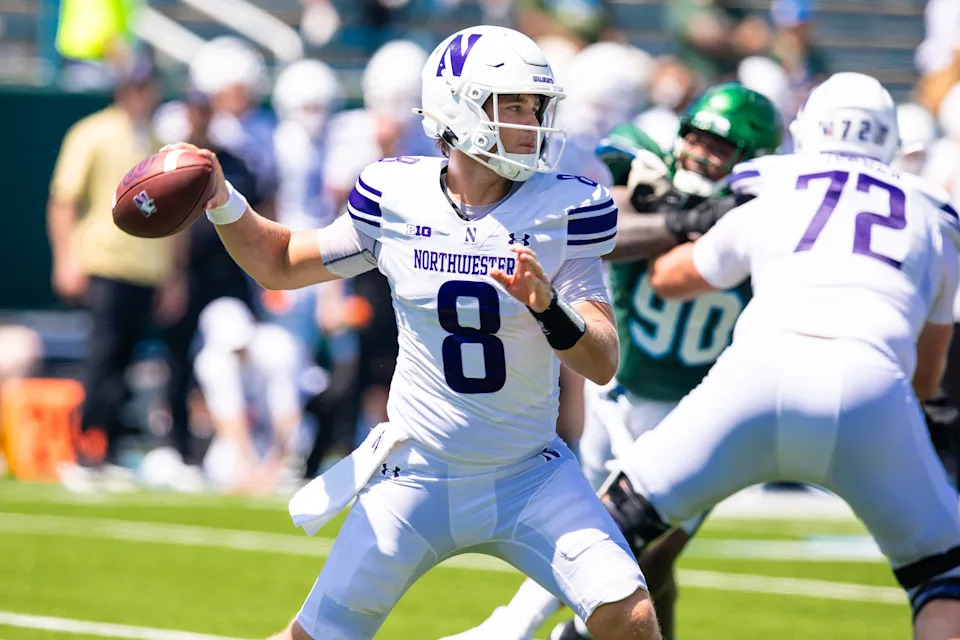 Aug 30, 2025; New Orleans, Louisiana, USA; Northwestern Wildcats quarterback Preston Stone (8) passes against Tulane Green Wave during the second half at Yulman Stadium. Mandatory Credit: Stephen Lew-Imagn Images