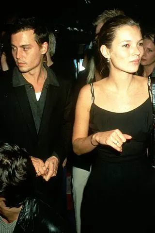 Foc Kan/WireImage Johnny Depp (left) with then-girlfriend Kate Moss at Les Bains Douches in Paris in the 1990s