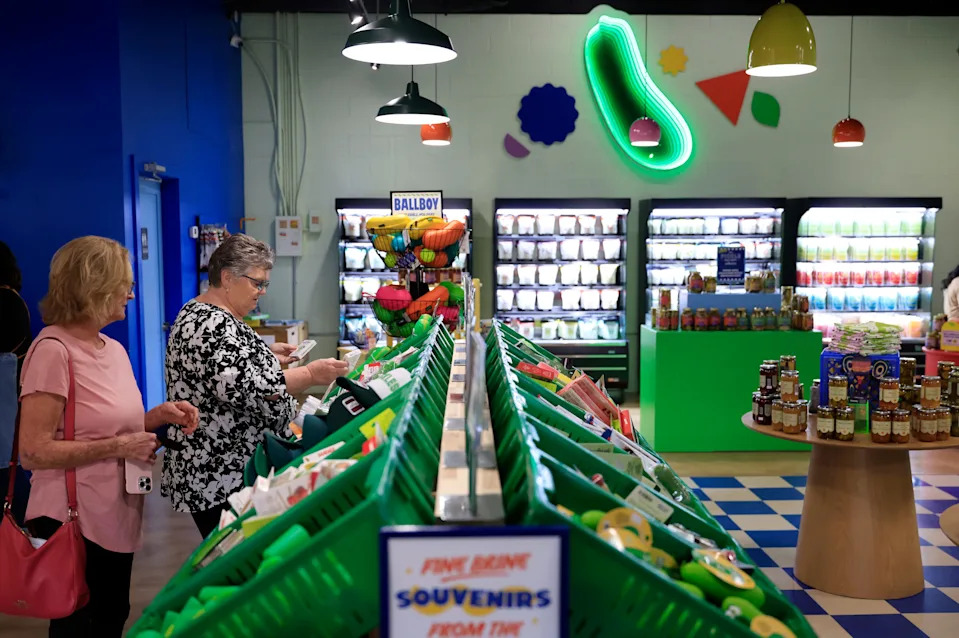 Marcia Jones, left, talks with Brenda Cooner at The Pickle Factory, Wednesday, Oct. 8, 2025, in Jacksonville, Fla. The retail outlet that sells all things pickle, has expanded an additional 1,500 square feet of space.