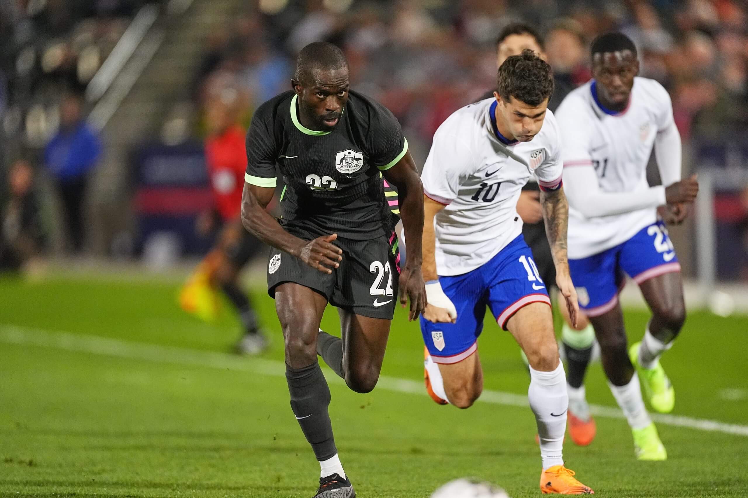 Christian Pulisic and Jason Geria battle for the ball in USMNT vs Australia