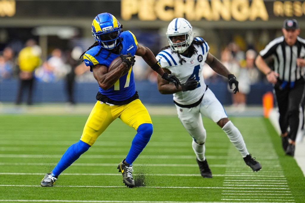 Los Angeles Rams wide receiver Davante Adams (17) runs past Indianapolis Colts cornerback Xavien Howard (4) after a catch during the second hall of an NFL football game Sunday, Sept. 28, 2025, in Inglewood, Calif.