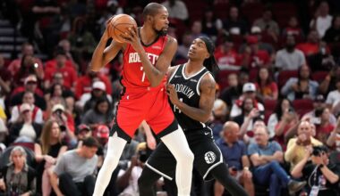 Houston Rockets forward Kevin Durant (7) controls the ball against Brooklyn Nets guard Terance Mann, right, during the first half of an NBA basketball game, Monday, Oct. 27, 2025, in Houston. (AP Photo/Karen Warren)
