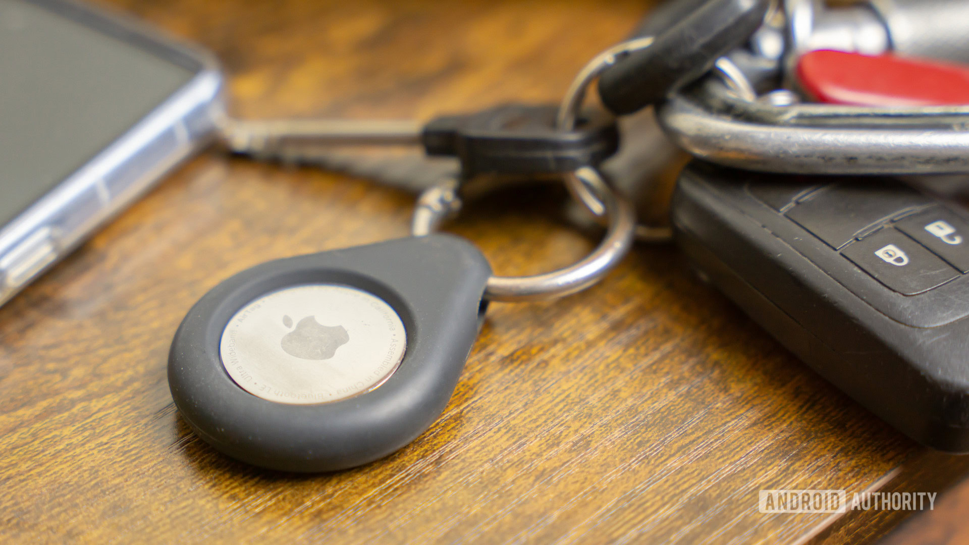 Apple AirTag on keychain stock photo Apple AirTag on keychain stock photo