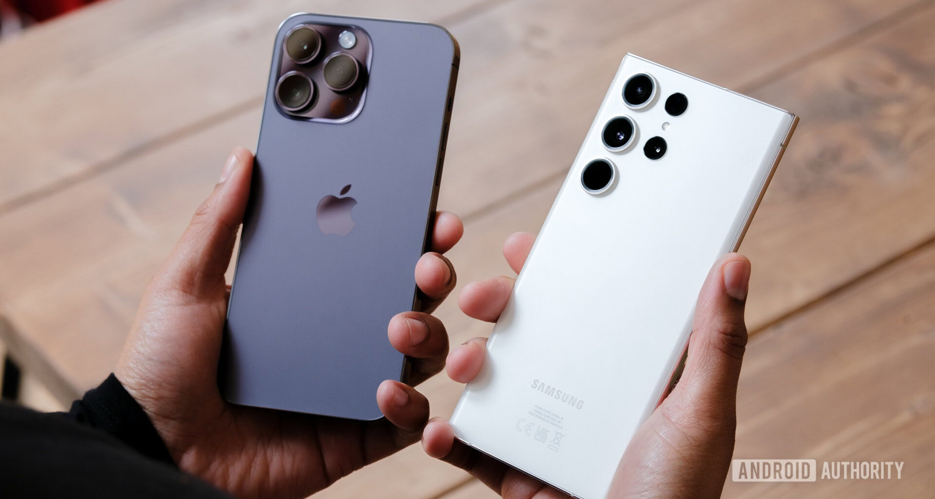 Apple iPhone 14 Pro Max vs Samsung Galaxy S23 Ultra in hand undecided