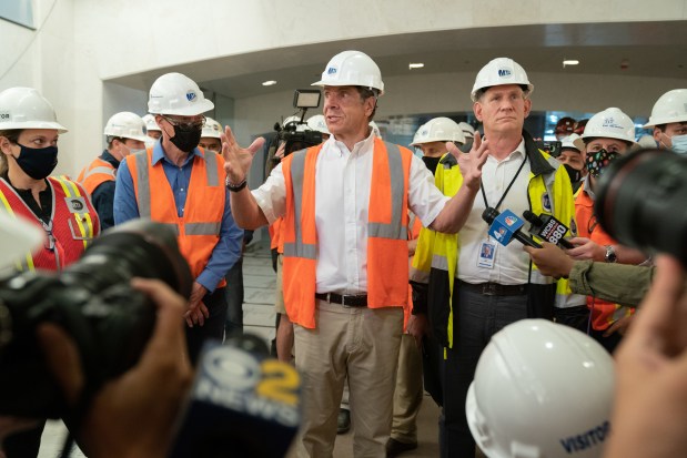 Gov. Andrew Cuomo (center) and Janno Lieber, chief development officer of the MTA (rght), talk to members of the media under Grand Central Station in the East Side Access project Thursday, May 27, 2021 in Manhattan, New York. (Barry Williams for New York Daily News)