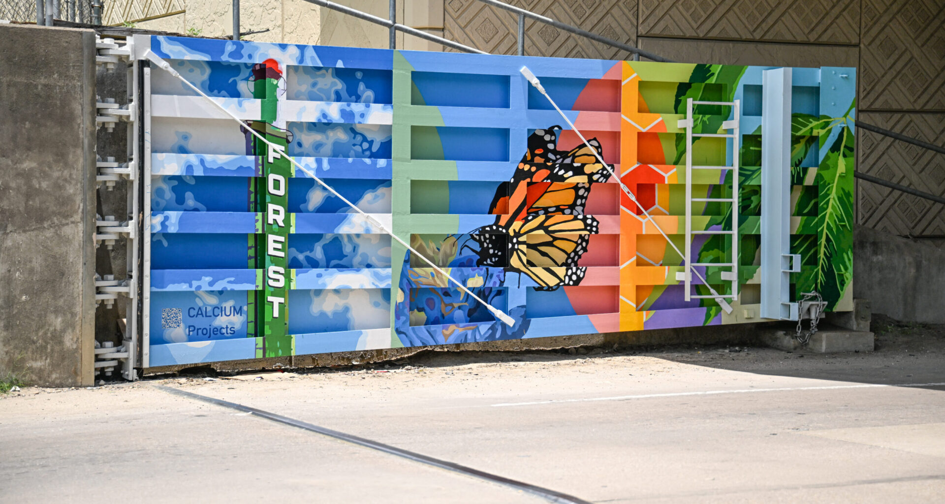 From Survival to Revival: Bonton's Floodgates Become a Symbol of Art, Homes, and Hope