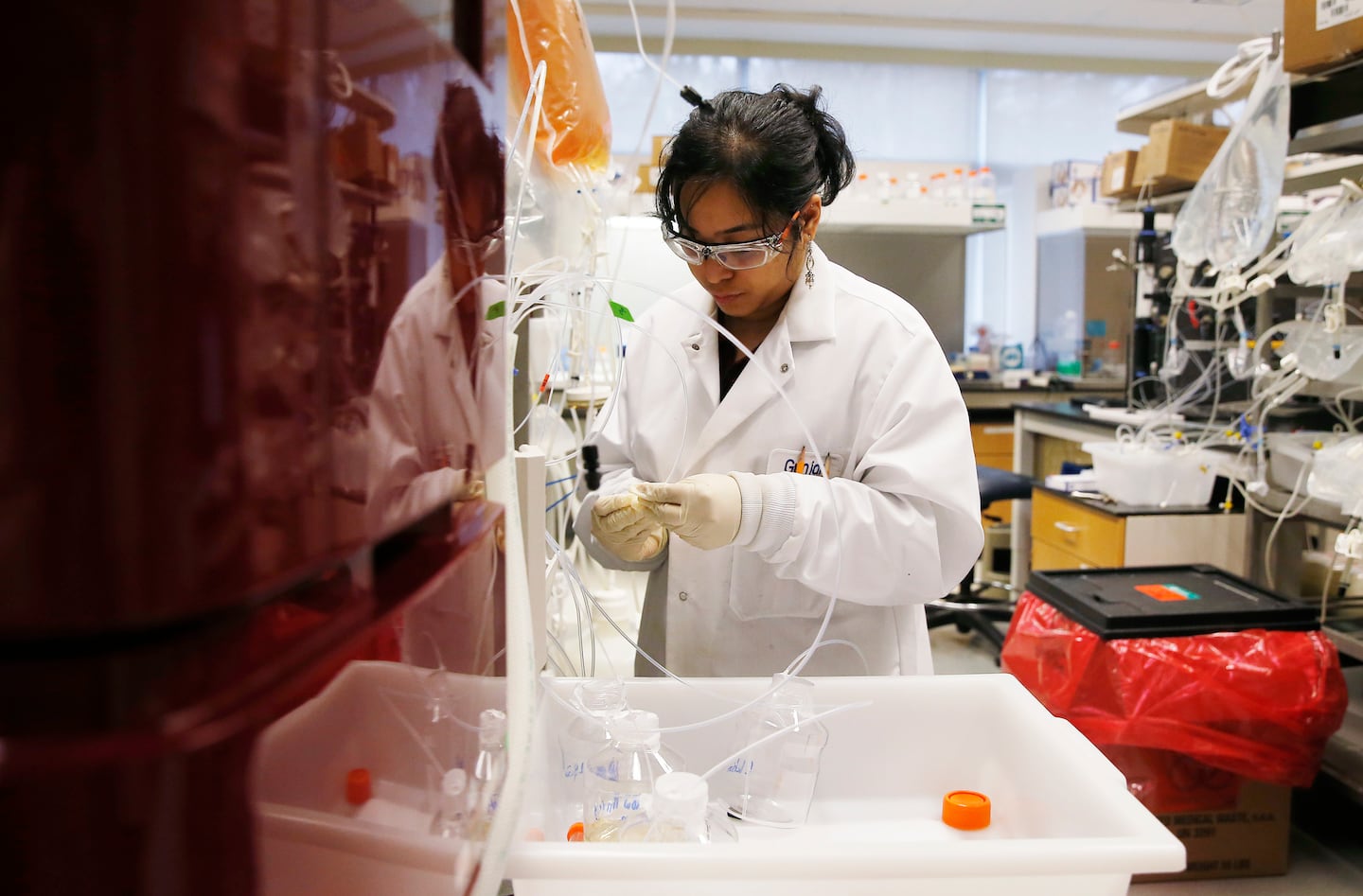 A research associate worked on biologic drugs at EMD Serono's lab in Bedford in 2017.