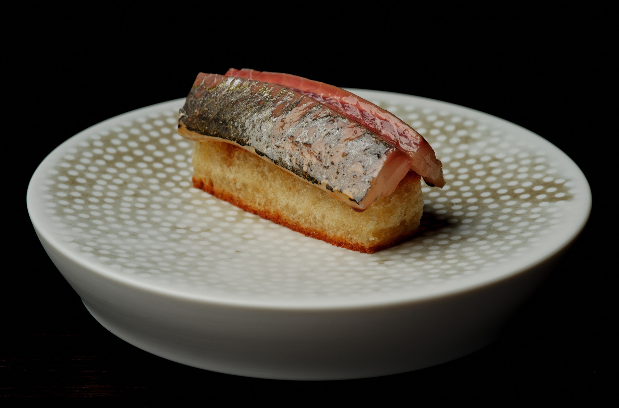 Slice of aji on milk bread toast at Corridor 109