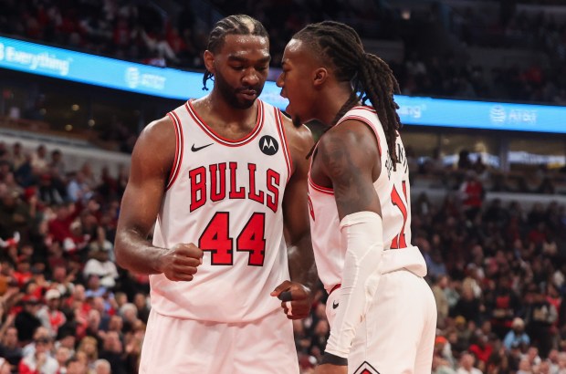 Chicago Bulls forward Patrick Williams (44) and Chicago Bulls guard Ayo Dosunmu (11) celebrate a foul being called while Williams made a basket in the second quarter during a game against the Atlanta Hawks, Monday, Oct. 27, 2025, at the United Center in Chicago. (Dominic Di Palermo/Chicago Tribune)
