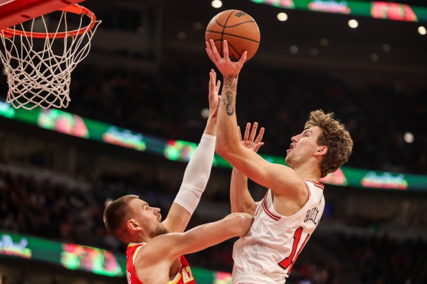 Chicago Bulls forward Matas Buzelis (14) makes a layup in the first quarter during a game against the Atlanta Hawks, Monday, Oct. 27, 2025, at the United Center in Chicago. (Dominic Di Palermo/Chicago Tribune)