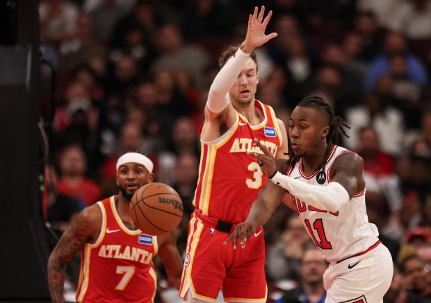 Chicago Bulls guard Ayo Dosunmu (11) passes the ball in the third quarter during a game against the Atlanta Hawks, Monday, Oct. 27, 2025, at the United Center in Chicago. (Dominic Di Palermo/Chicago Tribune)