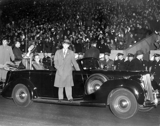 President Franklin D. Roosevelt waves his hat toward the crowd at Soldier Field in Chicago on Oct. 28, 1944. (Chicago Tribune archive)