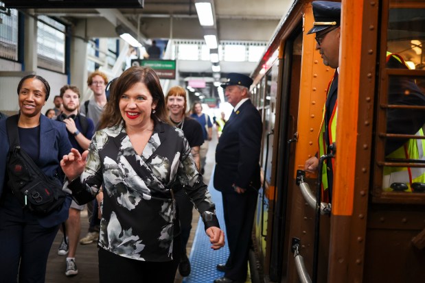 Nora Leerhsen, the acting president of the CTA, gets on a 1920s-era 4000-series railcar in the Loop on Oct. 1, 2025, where the CTA celebrated their 78th anniversary with Heritage Fleet Program rides for customers. (Eileen T. Meslar/Chicago Tribune)