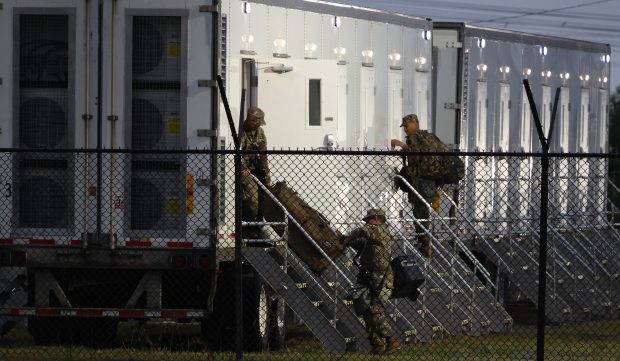 Members of the Texas National Guard assemble at the Army...