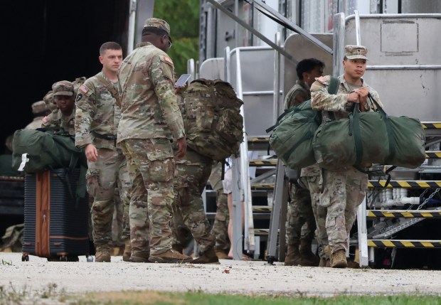 Members of the Texas National Guard assemble at the Army...