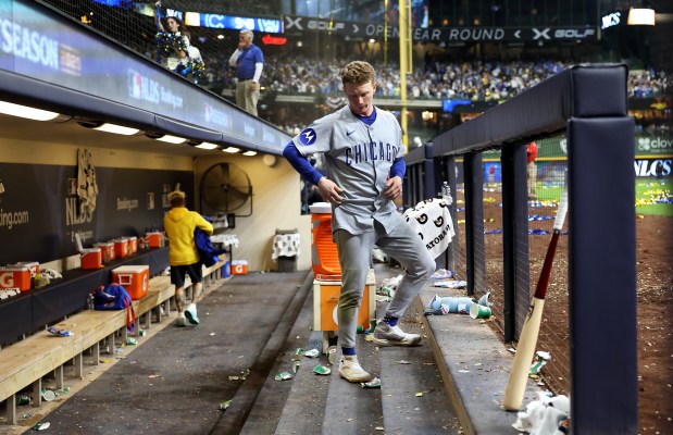 Chicago Cubs center fielder Pete Crow-Armstrong (4) stands in the dugout after losing to the Milwaukee Brewers in Game 5 of the NL Division Series at American Family Field in Milwaukee on Oct. 11, 2025. (Chris Sweda/Chicago Tribune)