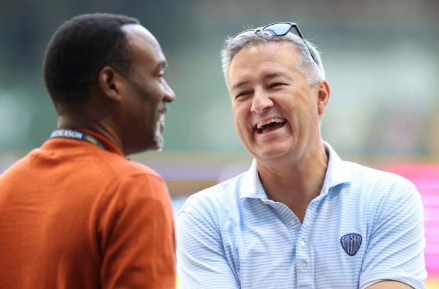 Chicago Cubs chairman Tom Ricketts has a laugh on the field before the NL Division Series Game 1 against the Milwaukee Brewers at American Family Field in Milwaukee on Oct. 4, 2025. (Chris Sweda/Chicago Tribune)
