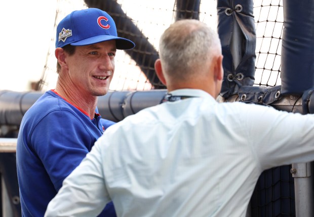 Chicago Cubs manager Craig Counsell has a conversation with Cubs president of baseball operations Jed Hoyer before the start of the NL Division Series Game 1 against the Milwaukee Brewers at American Family Field in Milwaukee on Oct. 4, 2025. (Chris Sweda/Chicago Tribune)