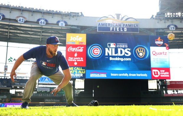 Chicago Cubs first baseman Michael Busch warms up for the NL Division Series Game 1 against the Milwaukee Brewers at American Family Field in Milwaukee on Oct. 4, 2025. (Chris Sweda/Chicago Tribune)