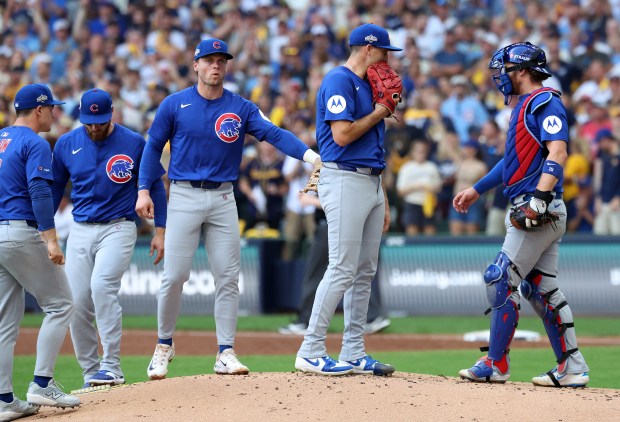 Chicago Cubs starting pitcher Matthew Boyd (second from right) stands on the mound before being pulled from the game in the first inning of the NL Division Series Game 1 against the Milwaukee Brewers at American Family Field in Milwaukee on Oct. 4, 2025. (Chris Sweda/Chicago Tribune)