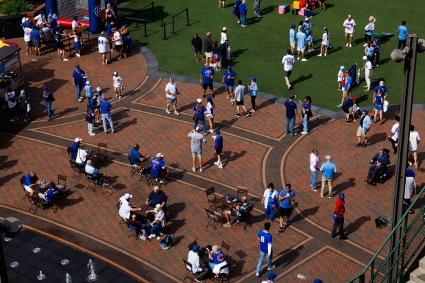 Fans walk outside the ballpark before the Cubs host the Padres in Game 2 of the wild-card series at Wrigley Field, Oct. 1, 2025. (Armando L. Sanchez/Chicago Tribune)