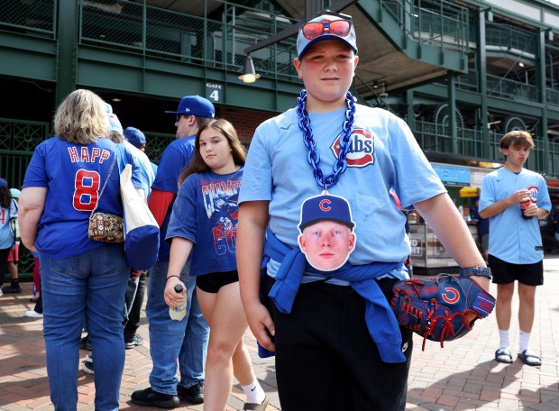 Pete Crow-Armstrong fan Gabe Carver, 12, of Marion, stands outside Wrigley Field before attending Game 2 of the NL wild-card series between the Cubs and the Padres on Oct. 1, 2025. (Chris Sweda/Chicago Tribune)