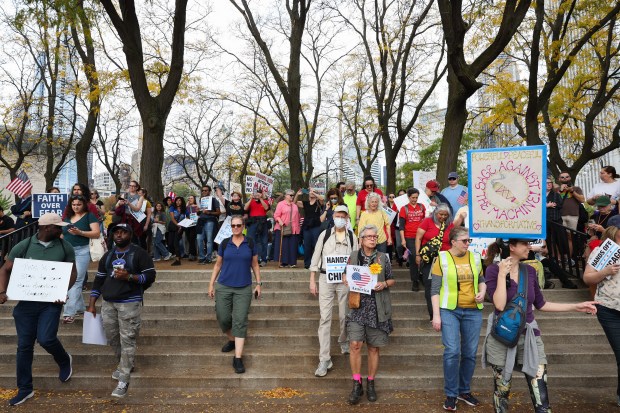 Demonstrators arrive at Butler Field for the "No Kings" rally and march, Oct. 18, 2025, in Chicago. (John J. Kim/Chicago Tribune)