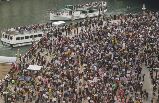 Demonstrators march through Wacker Drive during the "No Kings" march after a rally at Butler Field Saturday, Oct. 18, 2025, in Chicago. (John J. Kim/Chicago Tribune)