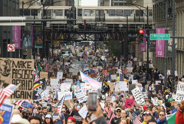 Demonstrators march through the Loop during the "No Kings" march after a rally at Butler Field, Oct. 18, 2025, in Chicago. (John J. Kim/Chicago Tribune)