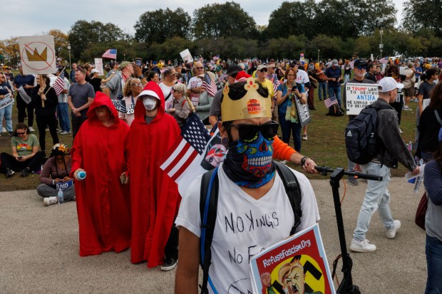 Alan Valenzuela wears a crown while attending a No Kings rally with other protesters in Chicago's Grant Park in response to President Donald Trump's increased immigration enforcement actions in the area, Oct. 18, 2025. (Armando L. Sanchez/Chicago Tribune)