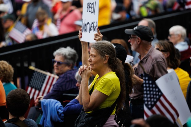 People gather while attending a No Kings rally in Grant Park in response to President Donald Trump's increased immigration enforcement actions in the area Saturday Oct. 18, 2025 in Chicago. (Armando L. Sanchez/Chicago Tribune)