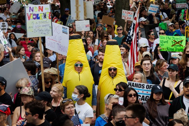 People gather while attending a No Kings rally in Grant Park, Oct. 18, 2025, in Chicago. (Armando L. Sanchez/Chicago Tribune)